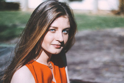 Close-up portrait of young woman at park