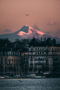 Scenic view of buildings against sky during sunset. genf, geneve, geneva, switzerland. alps.