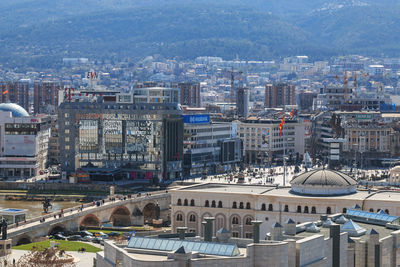 High angle view of cityscape against mountains