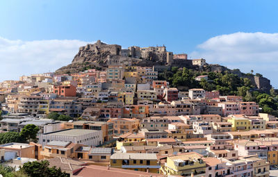 Buildings in town against sky