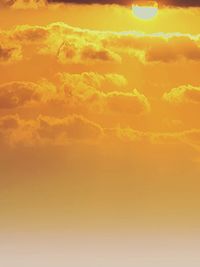 Scenic view of dramatic sky during sunset