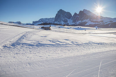 Scenic view of snow covered mountains against clear sky