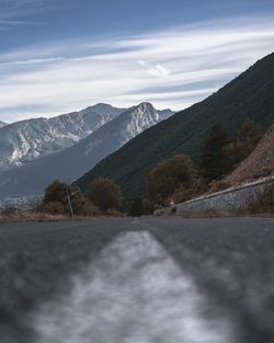 Road amidst mountains against sky