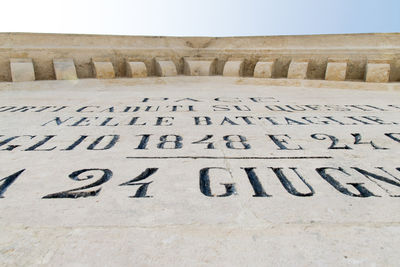 Text on stone wall