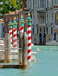 Close-up of bricole in a canal in venice, italy. cityscape from the grand canal in venice