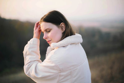 Portrait of a young woman on a sunny day in autumn