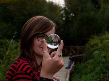 Portrait of beautiful woman drinking water