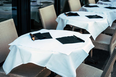 High angle view of chairs on table