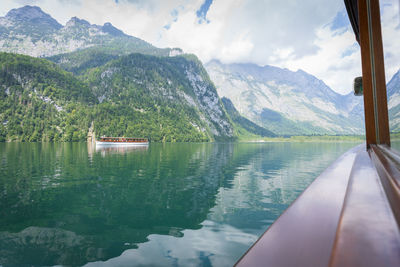 View from the boat sailing on a beautiful greenish alpine lake, konigsee, germany