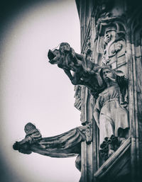 Low angle view of statue against sky