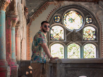 Young adult posing at the abandoned castle of spicer in beocin, serbia