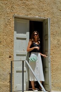 Woman looking through window