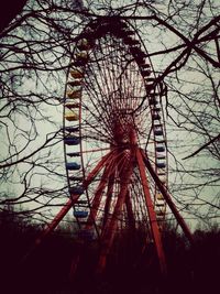 Low angle view of ferris wheel against sky