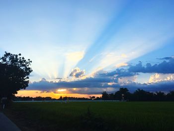Scenic view of field against sky during sunset