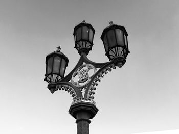 Low angle view of street light against sky