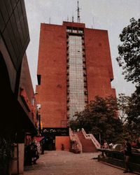 Low angle view of buildings in city against sky