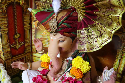 Low angle view of woman sculpture at market stall