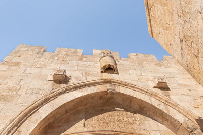 Low angle view of historical building against clear sky