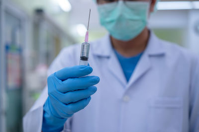 Close-up of person holding umbrella