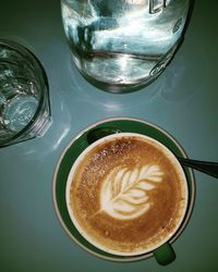 High angle view of cappuccino on table