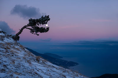 Scenic view of mountains against sky during sunset