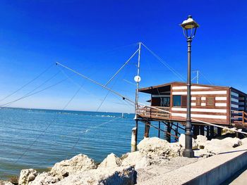 Scenic view of sea against clear blue sky