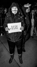 Full length portrait of man standing with text