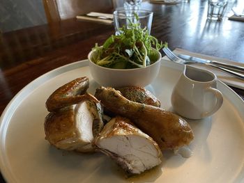 High angle view of roasted chicken served on table