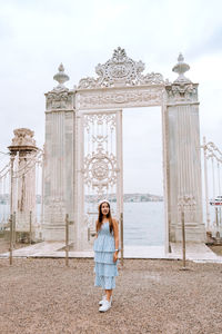 Woman standing in front of historical building