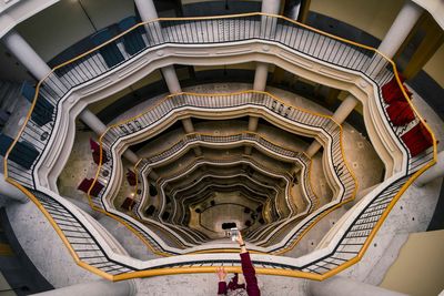 High angle view of woman photographing building