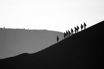 Silhouette landscape against clear sky