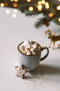 Cozy cup with hot cocoa, marshmallows and gingerbread