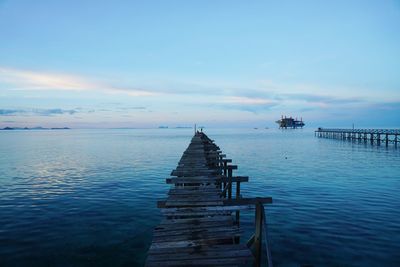 Pier on sea against sky