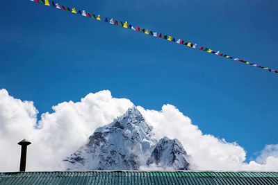 Low angle view of mountains against blue sky