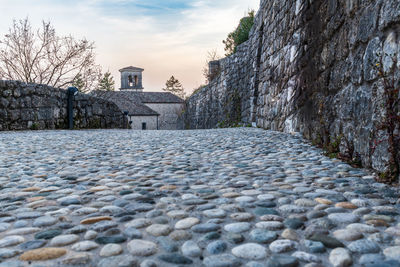 Sunset on the ancient castle of ragogna, italy. fortress guarding the ford on the river tagliamento