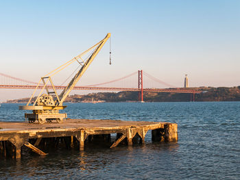 View of suspension bridge over sea