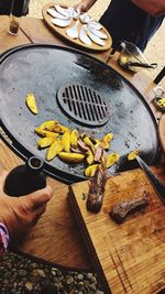 High angle view of person preparing food on cutting board