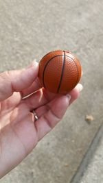 Close-up of hand holding ball