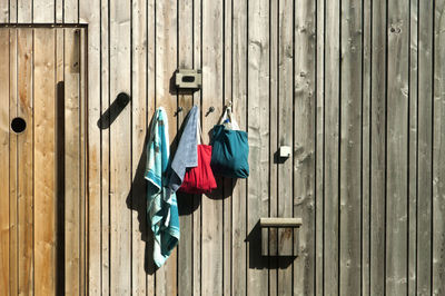 Clothes drying on wooden door