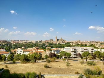 View of townscape against blue sky