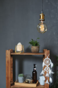 Close-up of illuminated light bulb on table