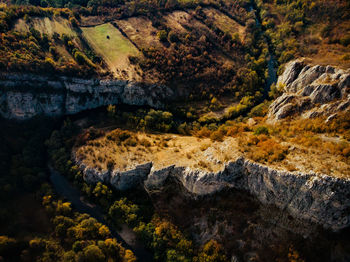 High angle view of river flowing through mountain