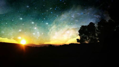 Scenic view of silhouette landscape against sky at night