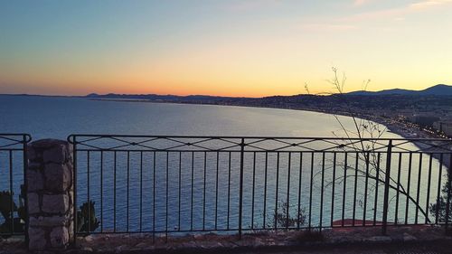 Scenic view of sea against clear sky during sunset