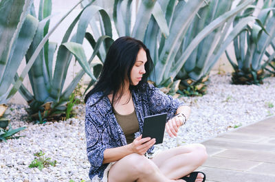 Happy asian woman, student relaxing, working in city, garden. laptop, phone. social media. summer