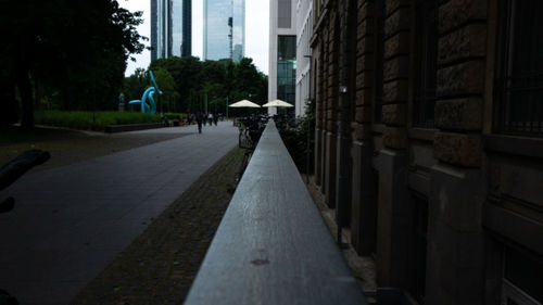 Empty alley amidst buildings in city