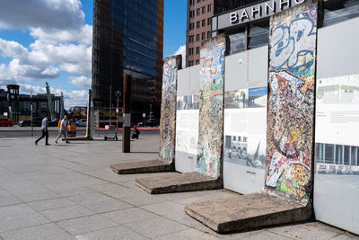 Street amidst buildings in city against sky