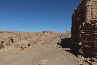 View of old ruins against clear blue sky