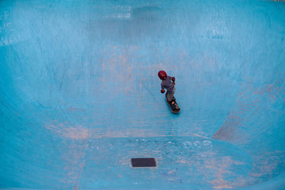 High angle view of boy skateboarding at park