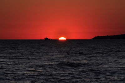 Scenic view of sea at sunset